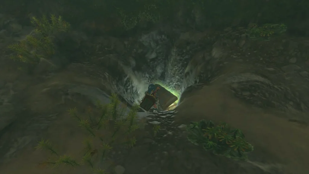 Treasure chest glowing at the bottom of a rocky pit Treasure chest glowing at the bottom of a rocky pit