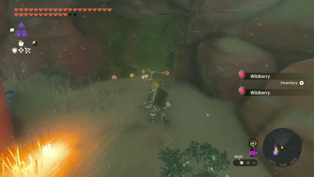 Cave entrance among the rocks of the Gerudo Highlands with a campfire beside it Cave entrance among the rocks of the Gerudo Highlands with a campfire beside it