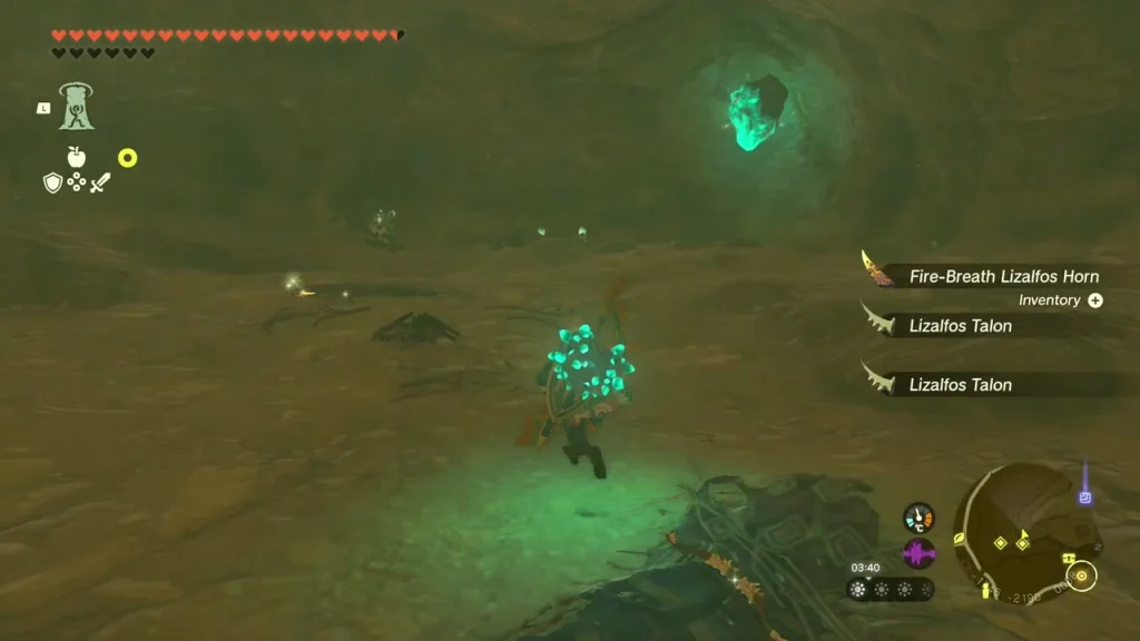 Glowing green ore deposit set in the cave wall above the floor