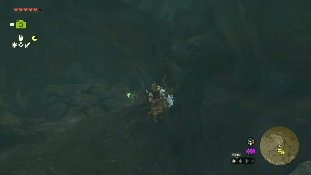 Dark cave floor and rubble inside the entrance