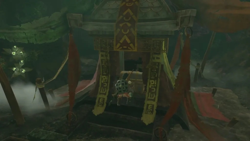 Stone shrine hung with red and gold banners with a chest between its pillars Stone shrine hung with red and gold banners with a chest between its pillars