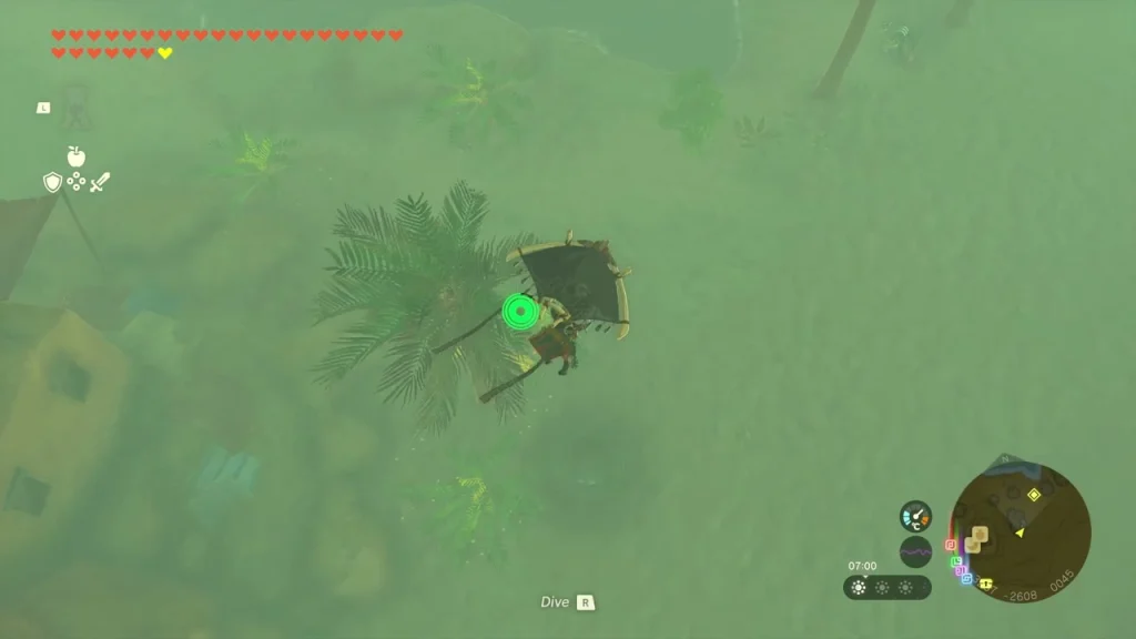 Palm-ringed oasis seen from above with the well opening below