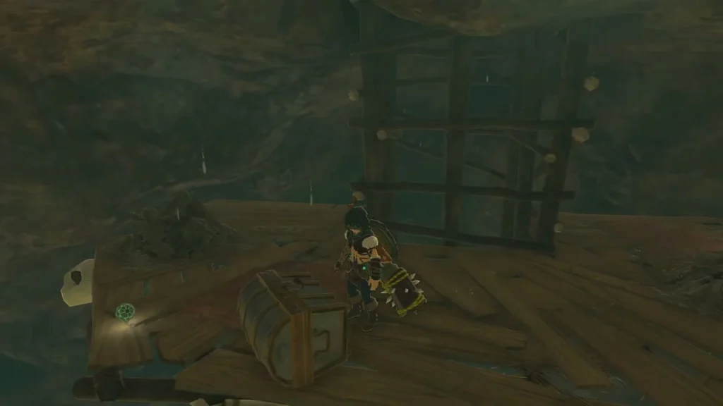 Chest on top of the second scaffold beside a wooden frame Chest on top of the second scaffold beside a wooden frame