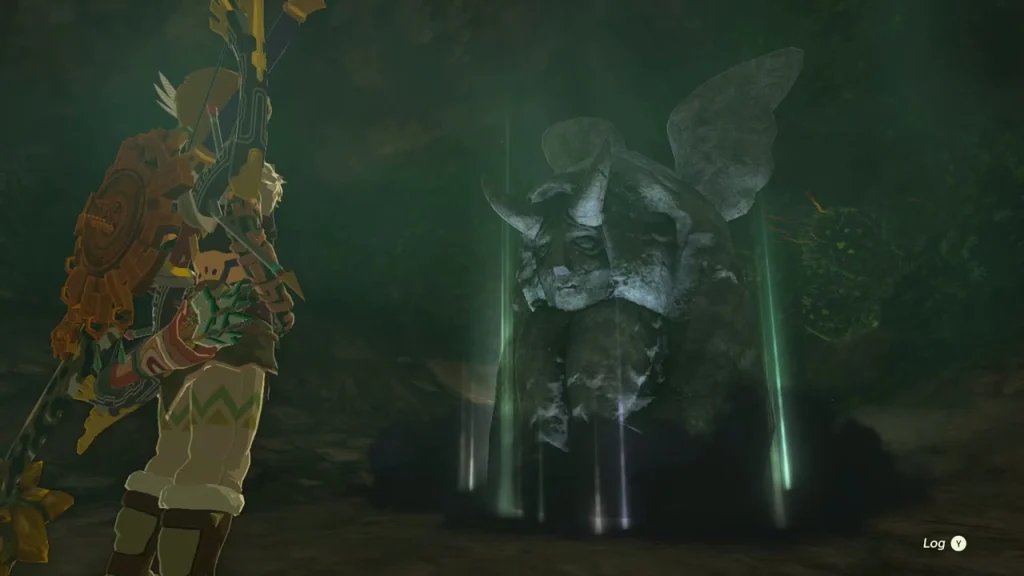 Horned statue glowing in the dark room