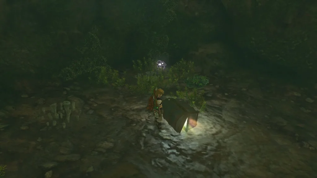 Open chest glowing in a mossy stone room