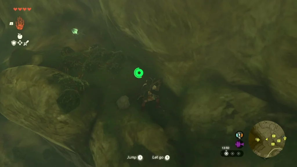 Climbable cave wall with Jump and Let go prompts on the way down to the cavern floor Climbable cave wall with Jump and Let go prompts on the way down to the cavern floor