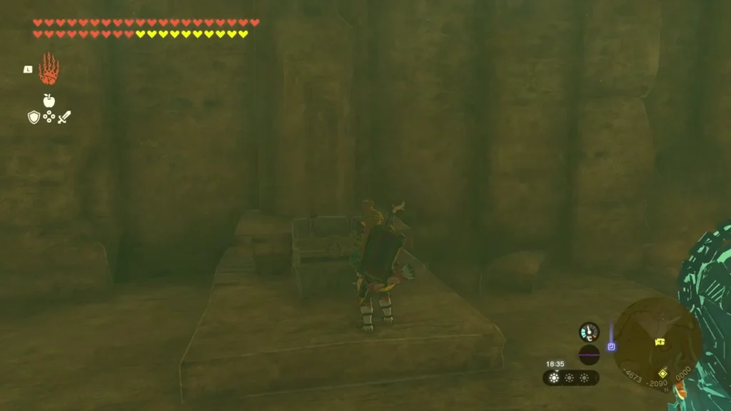Opened chest on a raised stone dais in the far room Opened chest on a raised stone dais in the far room