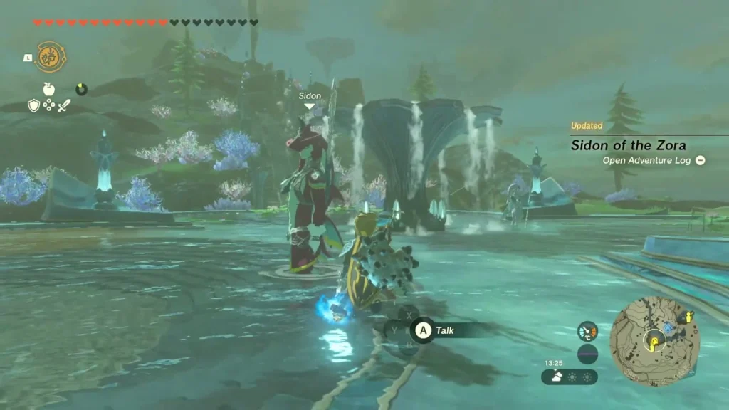 Sidon beside the pool at Mipha Court with the talk prompt shown Sidon beside the pool at Mipha Court with the talk prompt shown
