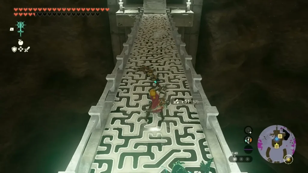 Long carved maze-pattern stone bridge stretching into a dark cavern Long carved maze-pattern stone bridge stretching into a dark cavern
