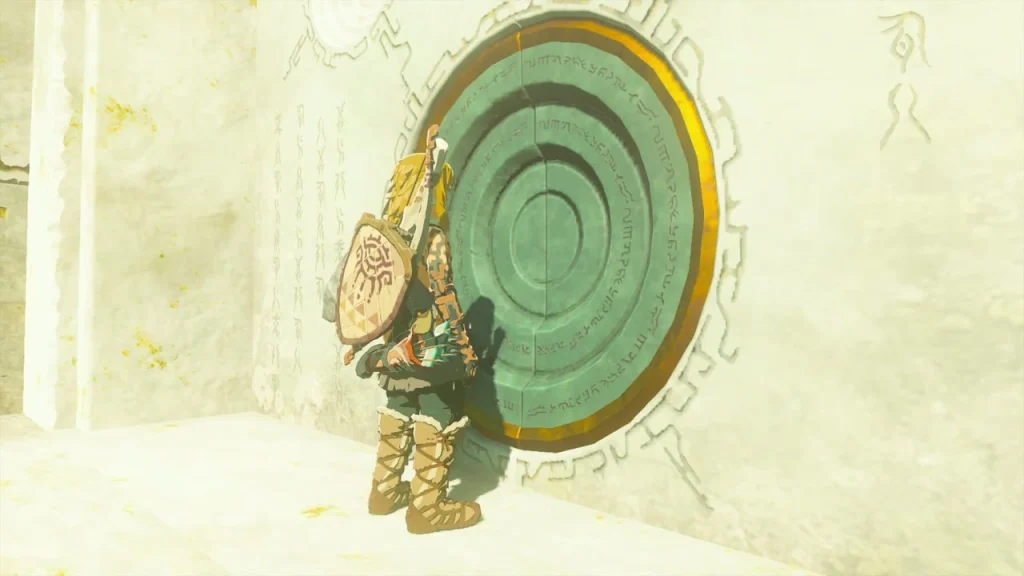Circular bronze door set into the temple wall with a glowing hand pressed against it Circular bronze door set into the temple wall with a glowing hand pressed against it
