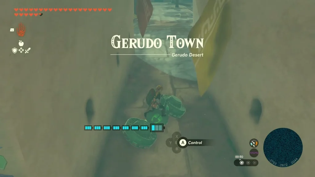 Entrance to Gerudo Town in the desert with the town name on screen Entrance to Gerudo Town in the desert with the town name on screen
