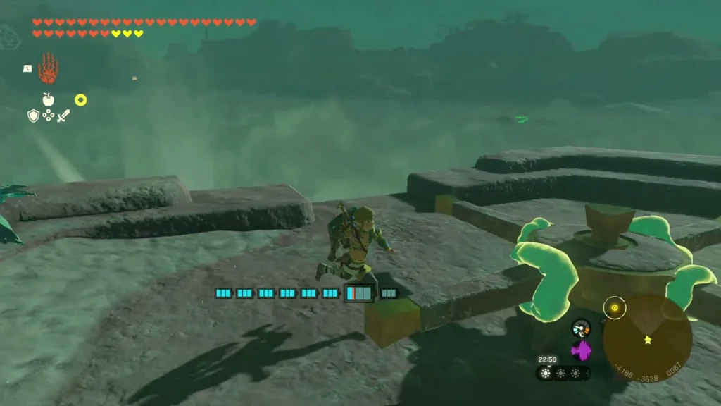 Wheel on top of the third pillar tower beside a green stone Wheel on top of the third pillar tower beside a green stone