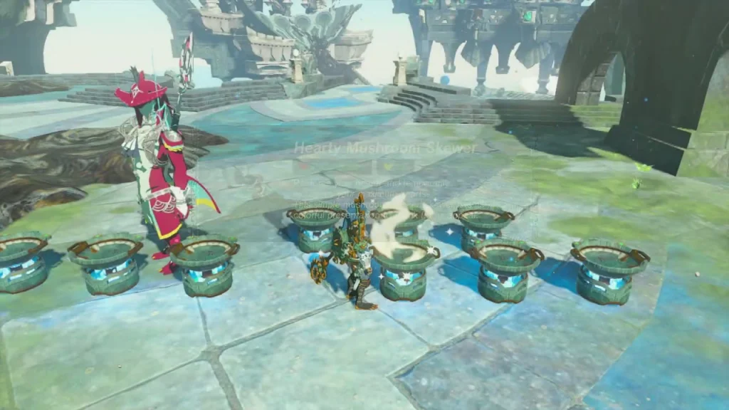 Sidon beside a row of bubble machines in the stone courtyard