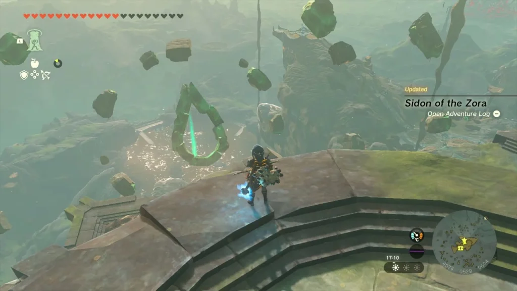 Green teardrop of floating stones with the pillar of light below