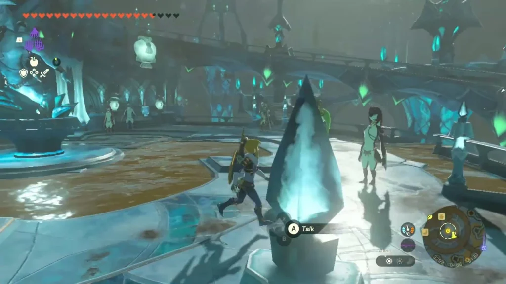 Crystal-blue statue base caked in sludge at the center of the plaza