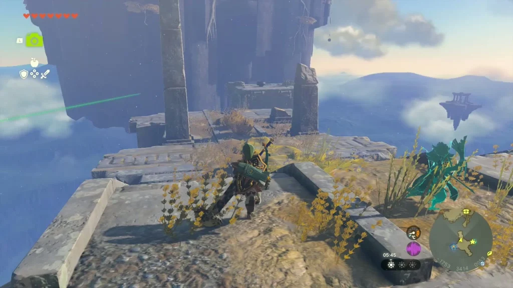 Ruined stone tower on a sky island with a green beam of light rising beside it