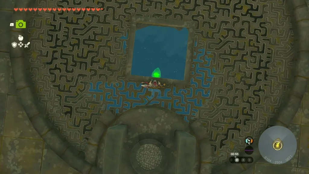Square hole in the carved island floor with the crystal at its edge Square hole in the carved island floor with the crystal at its edge