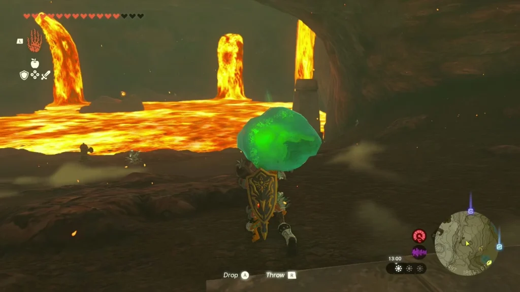 Green crystal held overhead at the edge of the lava Green crystal held overhead at the edge of the lava