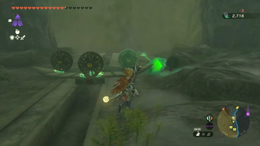 Green crystal resting near two Zonai wheels on the cave floor Green crystal resting near two Zonai wheels on the cave floor