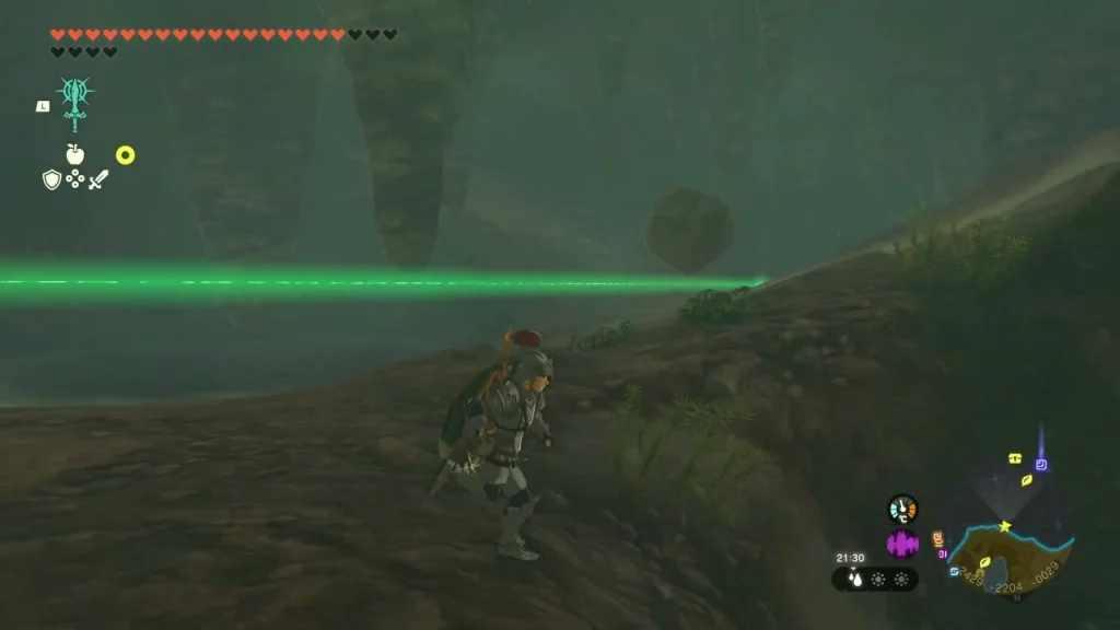 Green ray of light running across the cave from the crystal Green ray of light running across the cave from the crystal