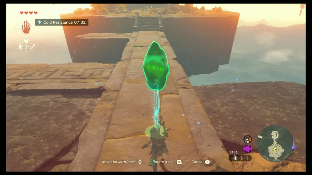 Green crystal held aloft along a stone walkway Green crystal held aloft along a stone walkway