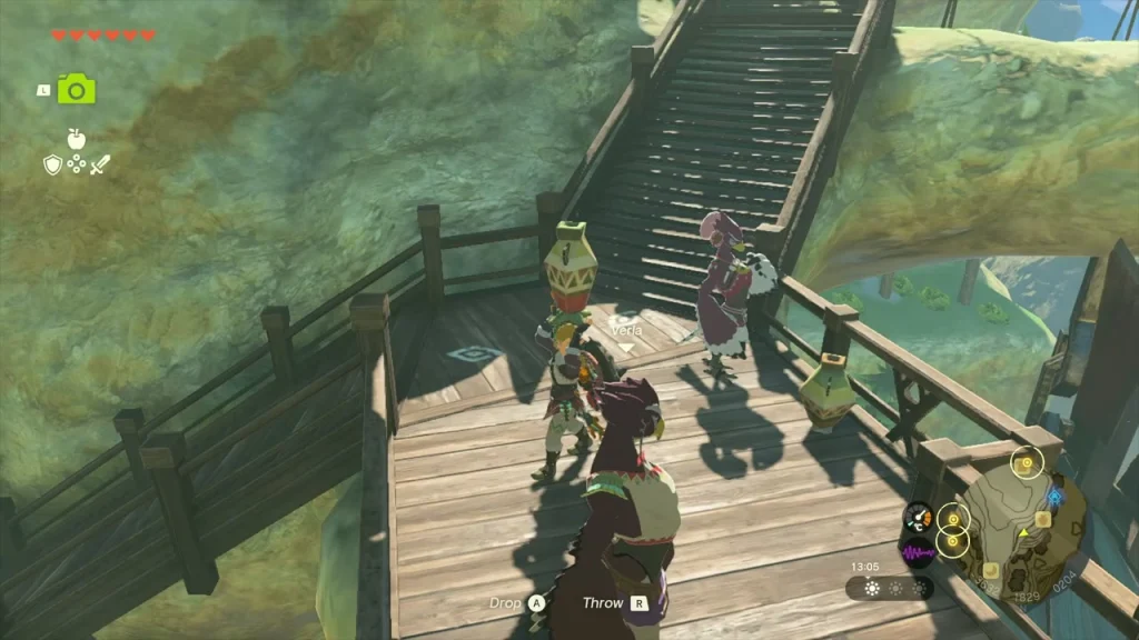 Laissa the Rito standing on the wooden stairs near the top of Rito Village Laissa the Rito standing on the wooden stairs near the top of Rito Village