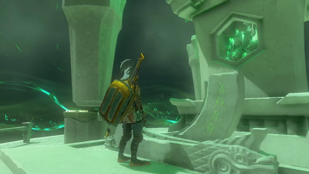Terminal with a green seal beside the stone dragon head at the top of the stairs