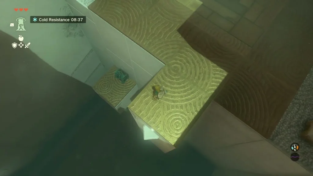 Chest on top of a square pillar seen from the ledge beside it Chest on top of a square pillar seen from the ledge beside it