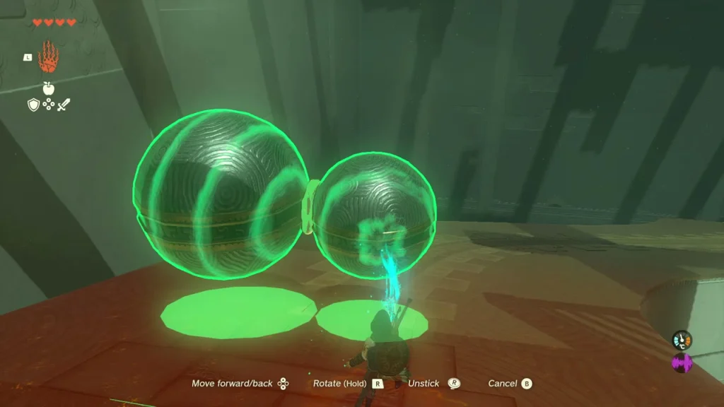 Large and small balls fused together into a chain with green markers beneath them Large and small balls fused together into a chain with green markers beneath them