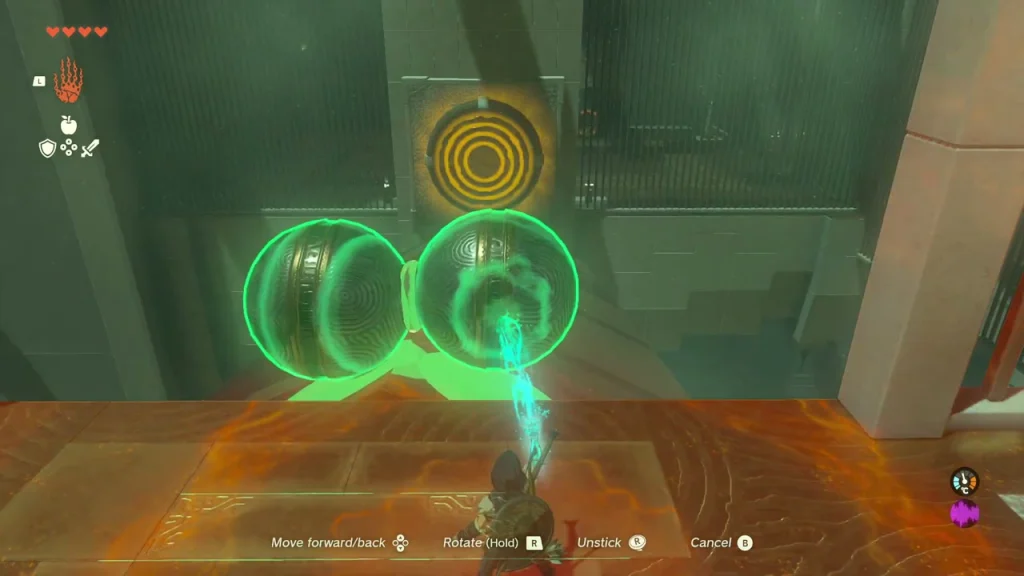 Two fused metal balls held in front of the second orange target Two fused metal balls held in front of the second orange target