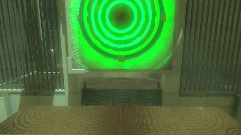 Wall target glowing green after being struck, with the gate beneath it Wall target glowing green after being struck, with the gate beneath it
