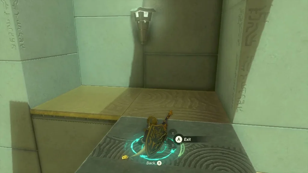 Ascend prompt under the underside of a block in a corner of the first chamber Ascend prompt under the underside of a block in a corner of the first chamber