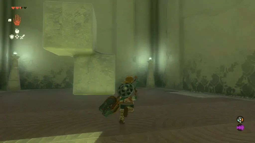 Block made of two offset stone cubes standing in the second room