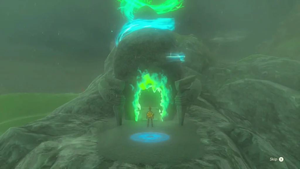 Shrine entrance glowing green at the base of a rocky outcrop with a blue warp pad Shrine entrance glowing green at the base of a rocky outcrop with a blue warp pad