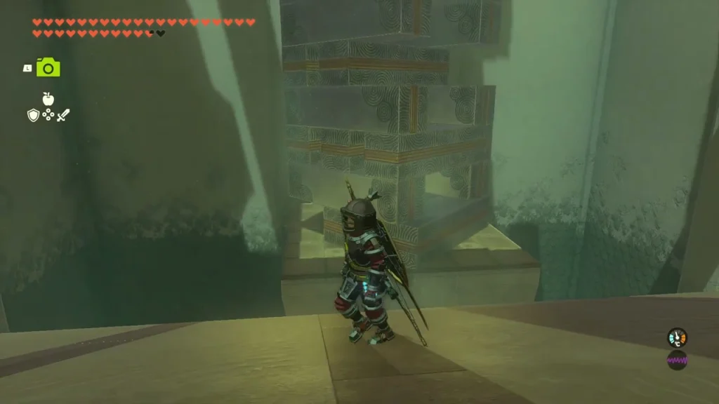 Tall tower of stacked stone blocks inside the shrine