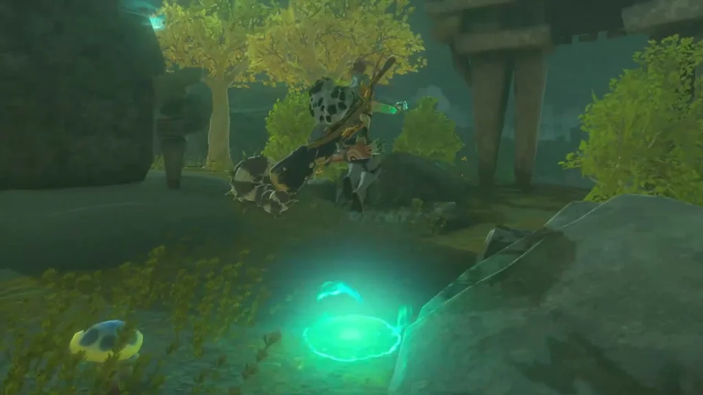 Glowing green pad on the ground beside the fallen ruins at the shrine entrance Glowing green pad on the ground beside the fallen ruins at the shrine entrance