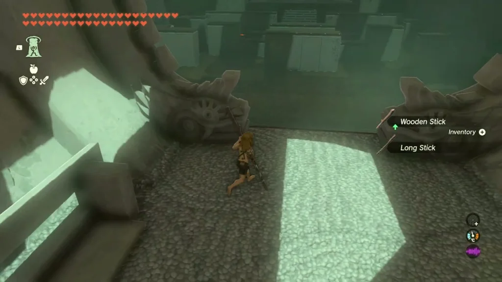 Wooden Stick and Long Stick lying on the Proving Grounds arena floor