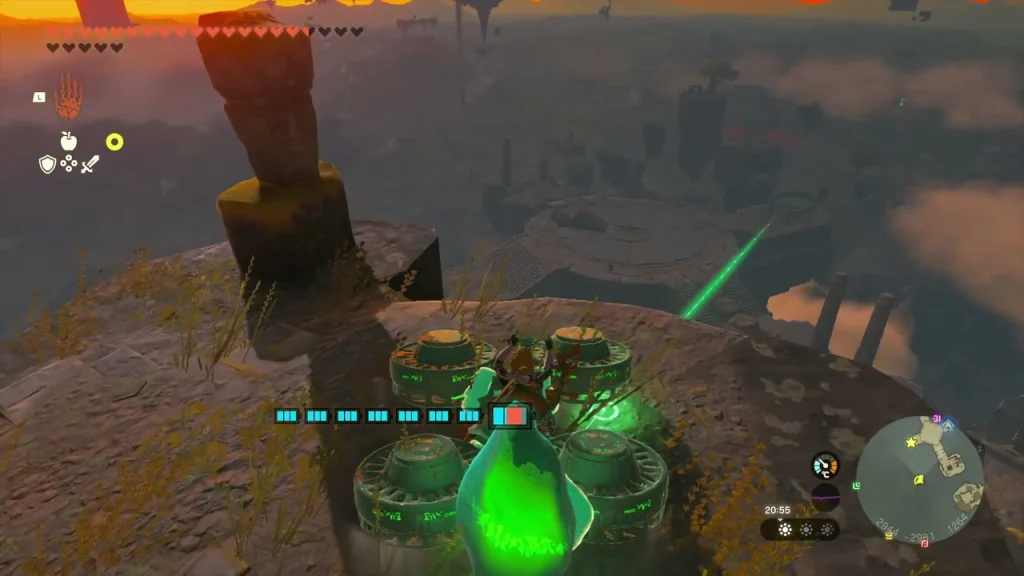 Glowing green crystal beside a Zonai contraption of cylinders on a sky island edge Glowing green crystal beside a Zonai contraption of cylinders on a sky island edge