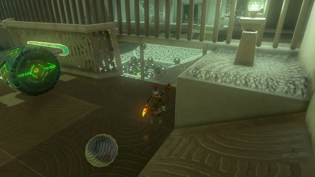 Metal ball on the floor beside the dish and a spare wheel Metal ball on the floor beside the dish and a spare wheel