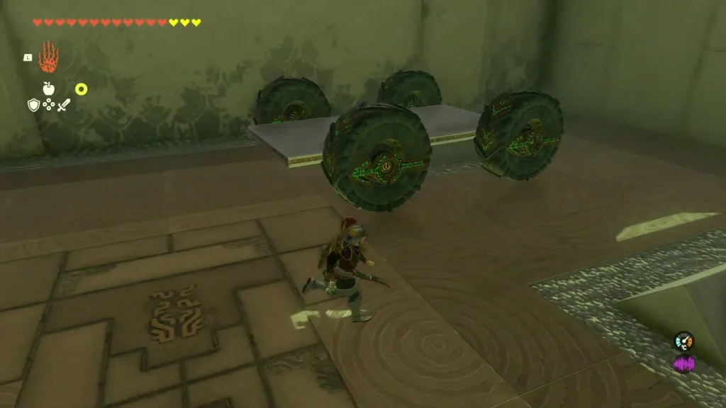 Pair of Zonai wheels joined by an axle on the shrine floor Pair of Zonai wheels joined by an axle on the shrine floor