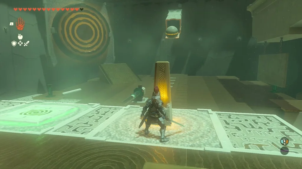 Orange ringed target on the wall above the pillar and floor pads Orange ringed target on the wall above the pillar and floor pads