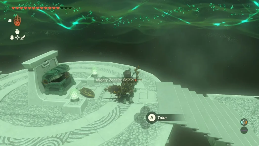 Open chest on a stone dais with the shield item prompt beside it