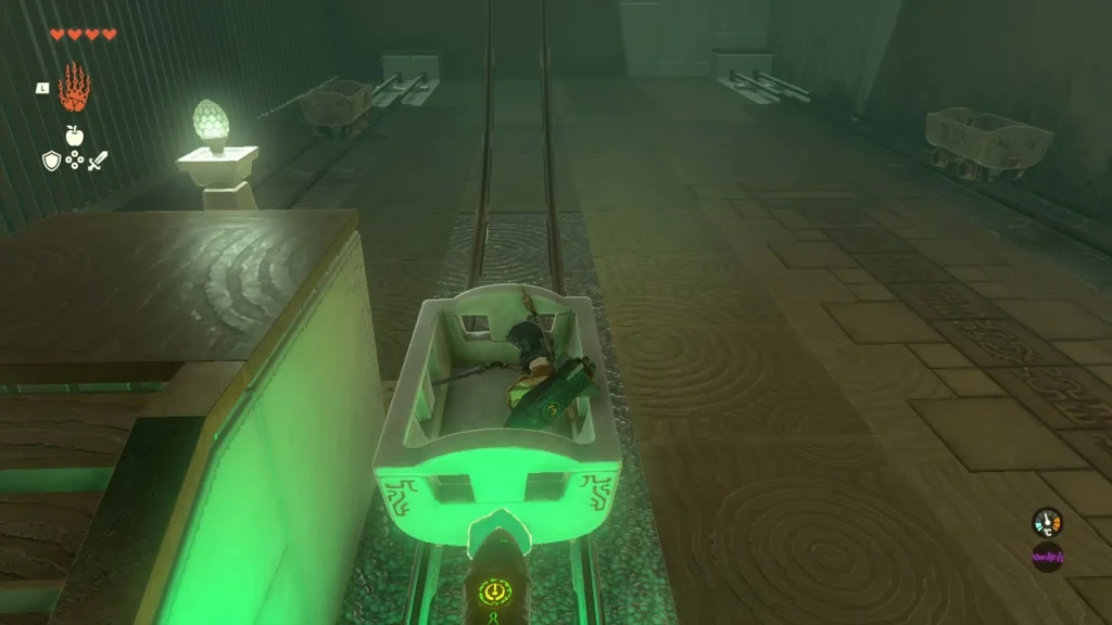 Green rail cart on the track with a rocket fused to its back Green rail cart on the track with a rocket fused to its back