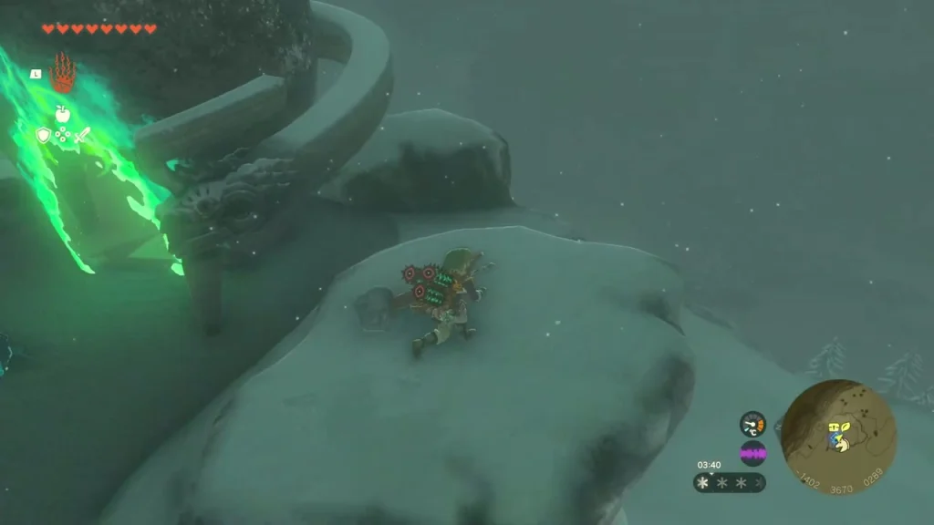 Green shrine entrance glow seen from a snowy ledge Green shrine entrance glow seen from a snowy ledge