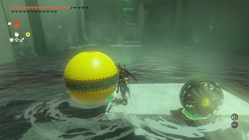 Large yellow spheres floating beside a fan in the water Large yellow spheres floating beside a fan in the water
