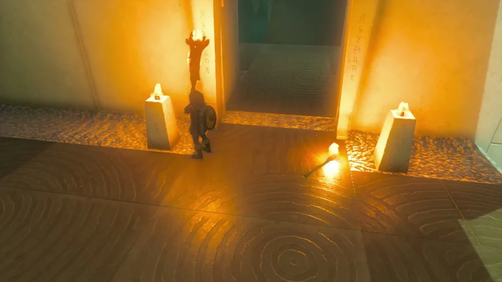 Gate burned away with an open doorway between two lit candles Gate burned away with an open doorway between two lit candles