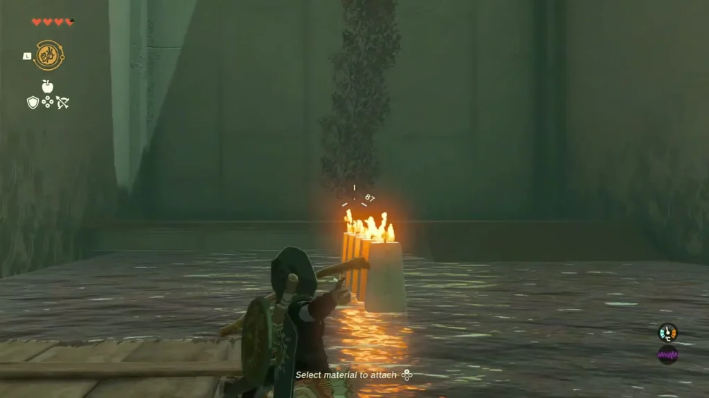 Weapon held to a lit candle with vines hanging above the channel Weapon held to a lit candle with vines hanging above the channel