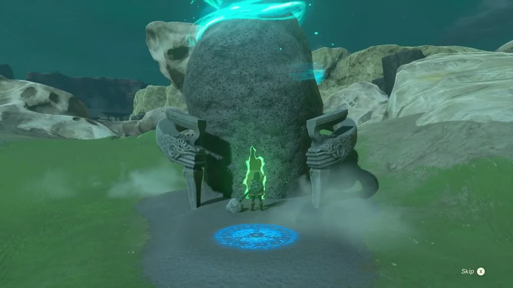 Shrine arch built into a rocky knoll with the blue entry platform in front Shrine arch built into a rocky knoll with the blue entry platform in front