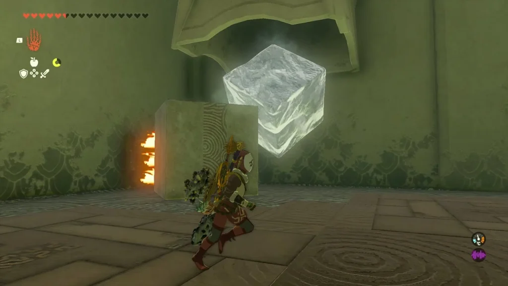 Ice block hanging beside a wall while a flame jet burns on its side Ice block hanging beside a wall while a flame jet burns on its side