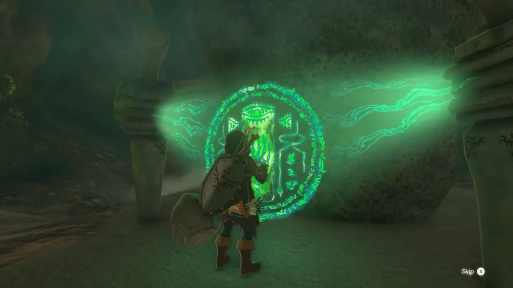 Green shrine seal glowing on the boulder beside the shrine in the dark cavern